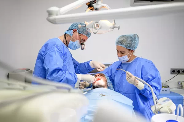 dental-surgeon-and-assistant-work-putting-dental-i-2026-01-05-01-03-28-utc.webp